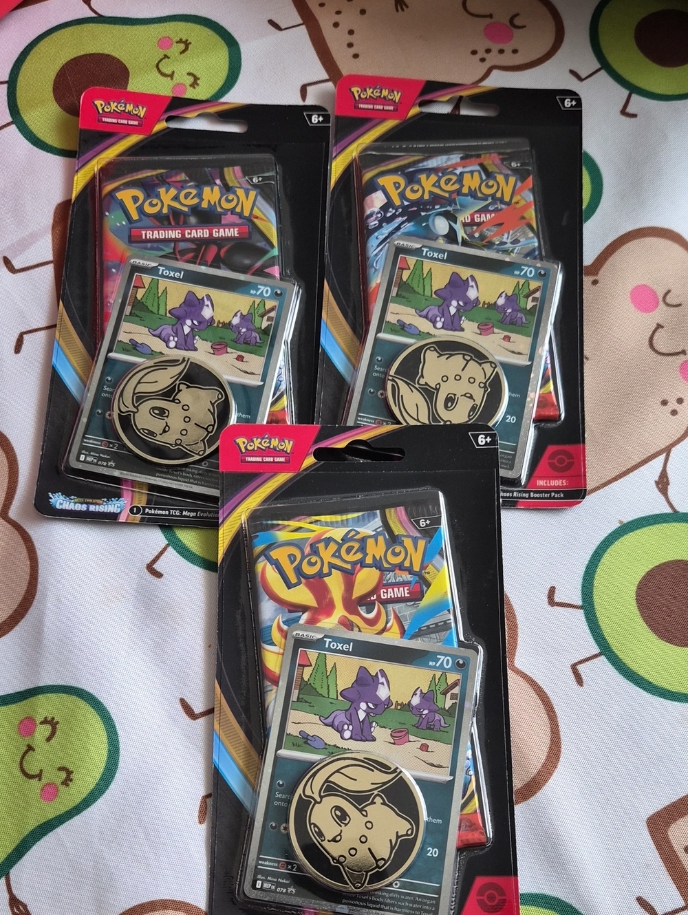 TCG: Toxel Mini Tin – Black and Gold Coin Included ()